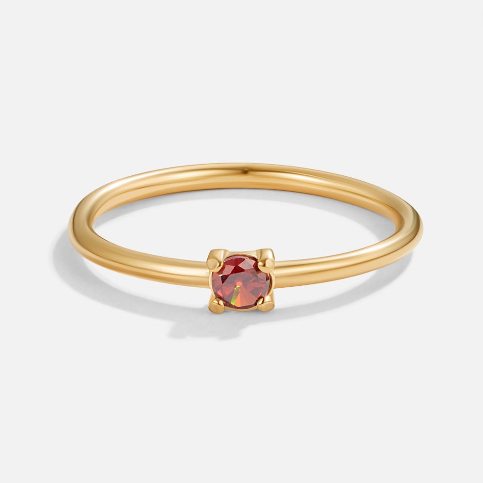 Bague en or avec pierre de naissance" → "Bague ornée de pierre de naissance