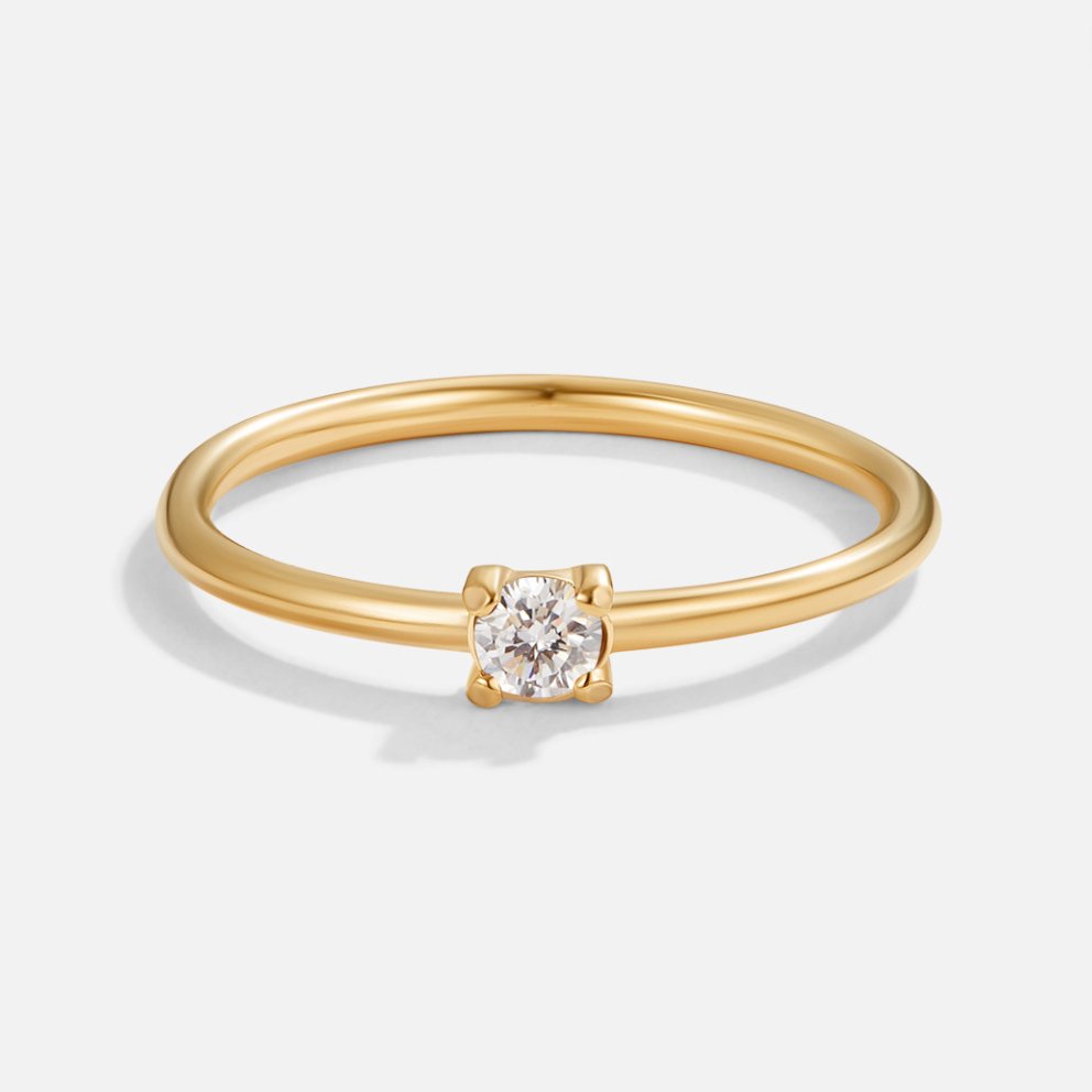 Bague en or avec pierre de naissance" → "Bague ornée de pierre de naissance