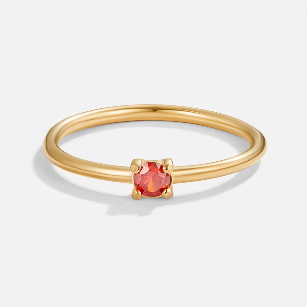 Bague en or avec pierre de naissance" → "Bague ornée de pierre de naissance