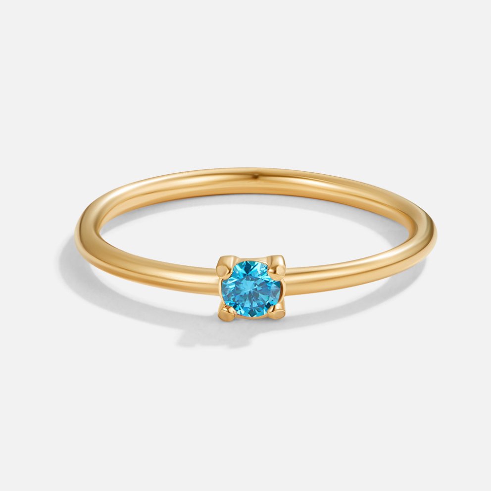 Bague en or avec pierre de naissance" → "Bague ornée de pierre de naissance