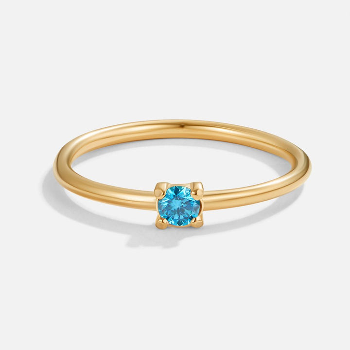 Bague en or avec pierre de naissance" → "Bague ornée de pierre de naissance
