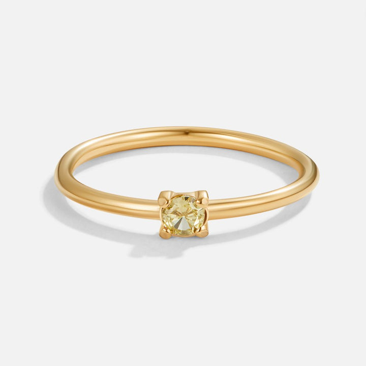 Bague en or avec pierre de naissance" → "Bague ornée de pierre de naissance