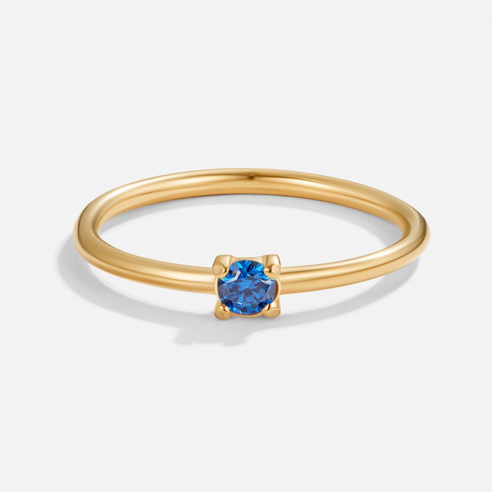 Bague en or avec pierre de naissance" → "Bague ornée de pierre de naissance