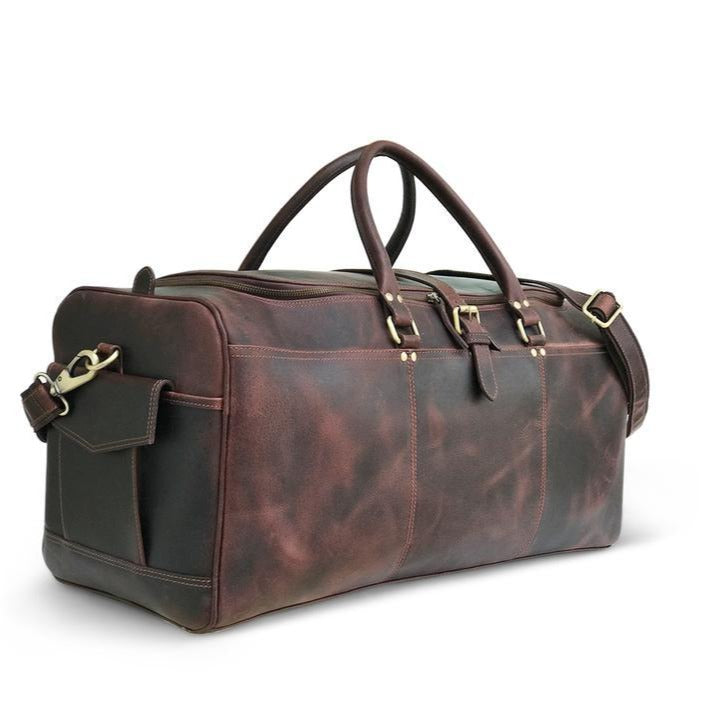 "Sac de week-end en cuir Hunter brun foncé" peut être reformulé en "Sac de week-end en cuir Hunter brun foncé".