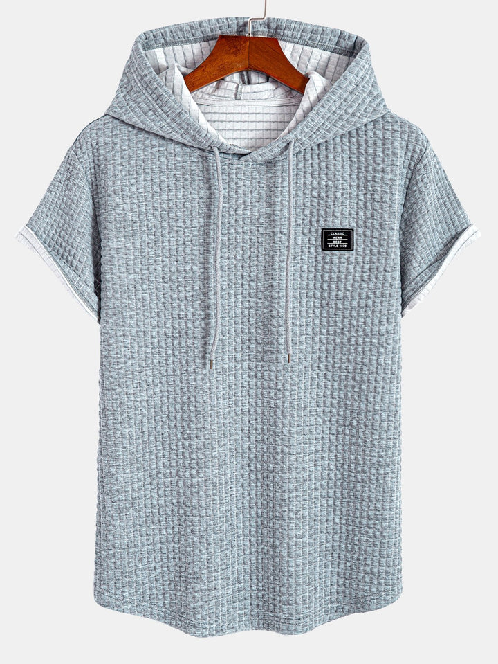 T-shirt à capuche en gaufre avec ourlet en arc